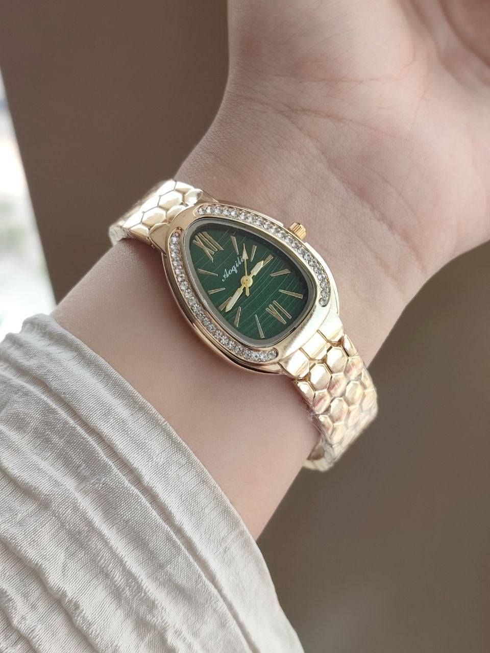 ساعت مچی زنانه Aoqili نگیندار مدل Serpenti، 5757229àبند فلزی طرح لانهزنبوری، صفحه بیضی - نمای بند